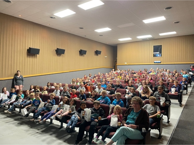 Students getting ready to watch a movie.